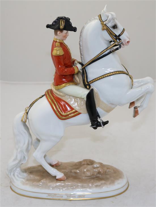 An Augarten Austria Spanish Riding School group, modelled by Dobrich, 28cm, loss to ear